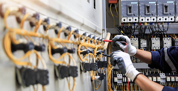 Professional Electrician technician working in Highland Acres, DE